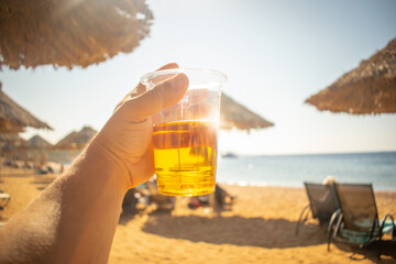 Beer Glass on a hot day on the beach, family vacation concept, Red Sea Aqaba Jordan exotic beach...