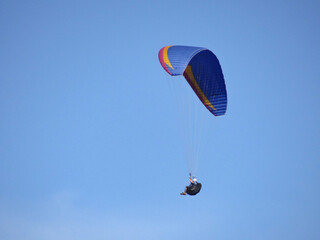 paragliding in the blue sky