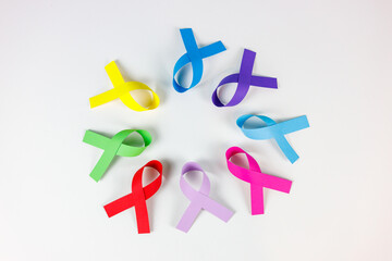 Colorful awareness ribbons on white background, world cancer day concept