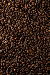 Roasted coffee beans background. Healthy beverage ingredients