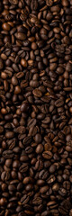 Roasted coffee beans background. Healthy beverage ingredients