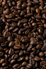 Roasted coffee beans background. Healthy beverage ingredients