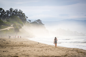 woman walking on the beach of santa barbara
