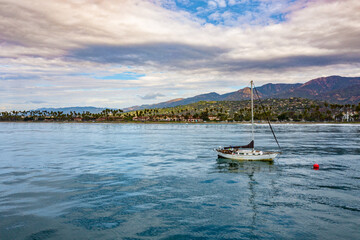 sailing boat at the coast of santa barbara during dusk