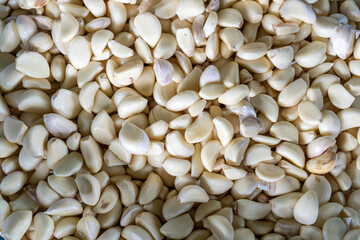 Closeup photo of peeled garlic.