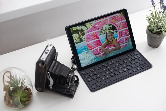 tablet, photo camera on an office desk