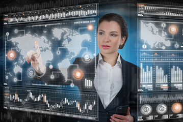 Young business lady works with virtual graphic interface in futuristic office