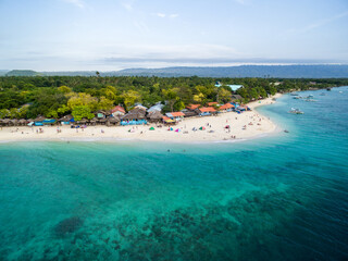 White Beach Moalboal in Cebu, Palawan, Philippines. Boat and Ocean Water and Beach.