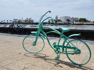 Old bicycle decorating the promenade of the bay of Arrecife
