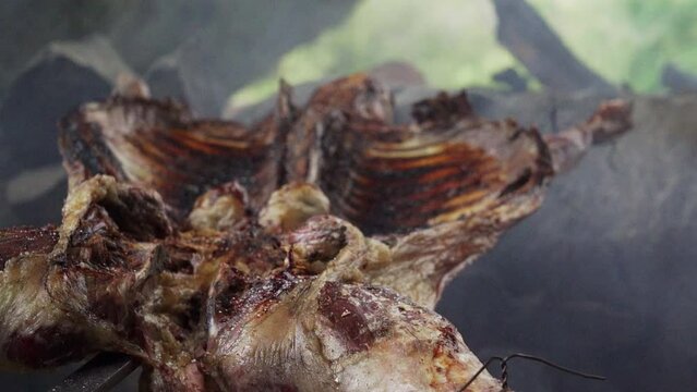 rustic lamb barbecue bbq over open fire in Patagonia
