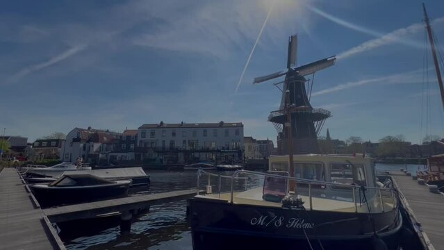 Street view of canal marina and windmill in Netherlands