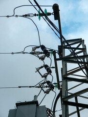 Electrical transformer tower with equipment and wire lines below view