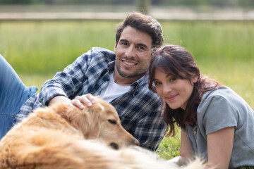 couple on picnic with pet dog