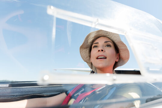 woman in glider waiting looking out at landscape
