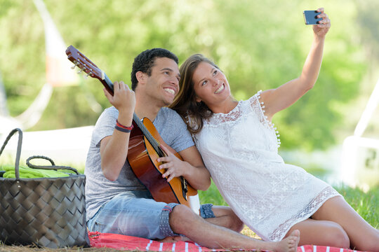 couple taking selfie during the picnic