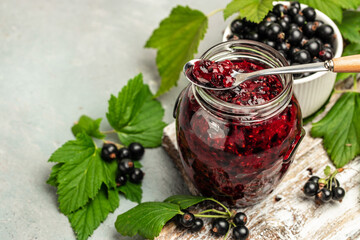 black currant jam curd, custard or jam in jar. place for text, top view