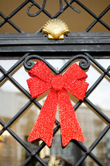 Red Christmas decoration on the door.