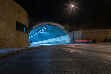 Amazing night photography road tunnel in Malaga in long time exposure. Empty road and streets at...