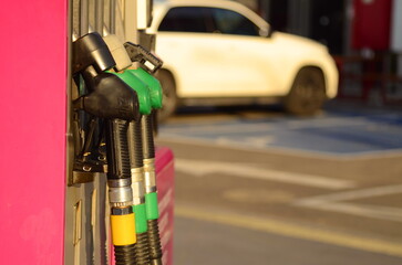 Refuel fill up with petrol gasoline. Petrol pump filling fuel nozzle in gas station. Petrol...