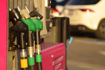 Refuel fill up with petrol gasoline. Petrol pump filling fuel nozzle in gas station. Petrol...