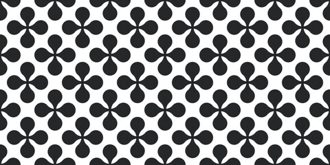 Black shapes create a seamless texture. The print is black and white, for seamless packaging, pillows, wallpapers, textiles, backgrounds.