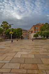 Malaga empty streets at early morning. Catedral de Malaga, Empty streets around Malaga La Manquita Cathedral in the light of the rising autumn sun. Andalusia, Spain.           