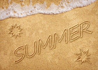 Word summer written on white sand beach. Summer holiday, travel and vacation concept. Abstract sea beach background