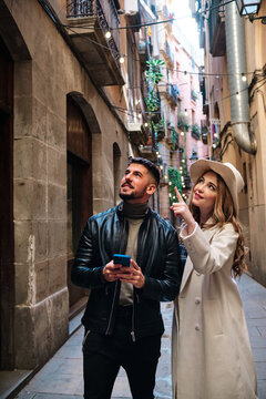 Tourists visiting a city and using a mobile phone