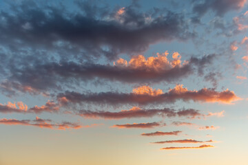 Sky of pink and orange clouds in the evening at sunset.