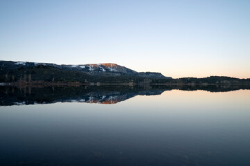 Panorama view of Lake Aluminé and the Andes mountains in the background, at sunset, in Villa Pehuenia, Patagonia Argentina.