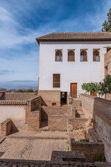 Alhambra de Granada. Palace and fortress of Granada. Ramparts, interiors, buildings, towers, courtyards of a medieval fortress in the Arab, Moorish style.                                              