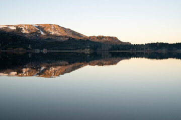 Lake Aluminé and the Andes mountains in the background, at sunset, in Villa Pehuenia, Patagonia Argentina.