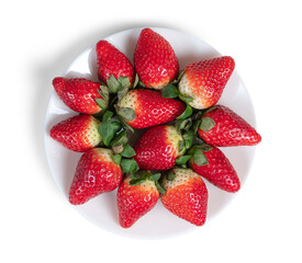Top view of a plate of strawberries isolated on the white background