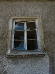 Broken glass in the building. Broken old window in the old wall
