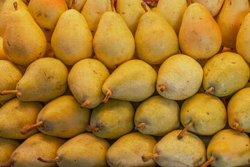 Close up of fresh pears. Pears in the market. Mediterranean food. Fresh pears background for graphics designers.