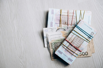 Three bundles of Ukrainian hryvnia money lie in a pile. Currency of Ukraine. monetary system