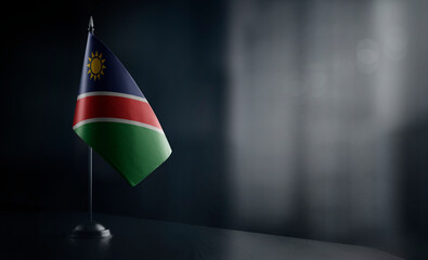 Small national flag of the Namibia on a black background
