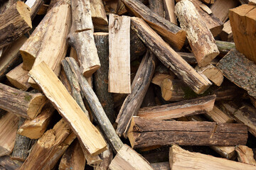 Lots of chopped oak firewood. Natural background.