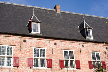 Fototapeta na wymiar Roof with black roof tiles of medieval house in the center of Amersfoort in the Netherlands