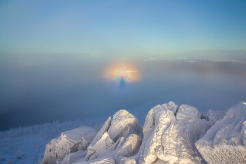 Brocken Spectre in winter mountains