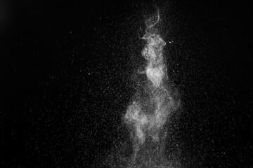 A jet of hot steam with splashes. The movement of hot steam with water droplets is highlighted on a...