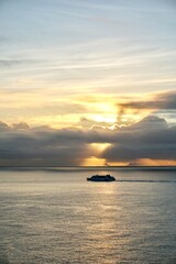 Naklejka na ściany i meble Cruise ship at sunset