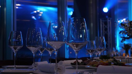 
Empty champagne glasses on the table in the restaurant hall, buffet table, restaurant interior, champagne glasses