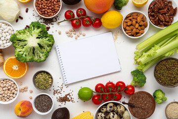 Food background with vegetables and beans paper white surface copy space