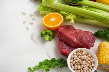 Food background with red meat and vegetables