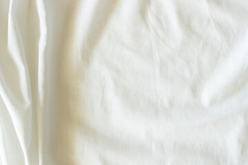 White crumpled linen fabric texture background. Natural linen organic eco textiles canvas background. Top view