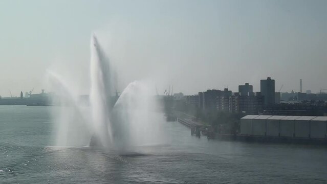 Tug boat splashing water - Rotterdam port