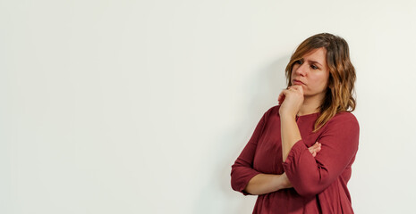 worried woman on a white background
