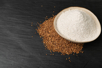 Buckwheat Flour Pile in Wood Bowl, Dry Buck Wheat Powder, Buckwheat Flour on Wooden Rustic Background