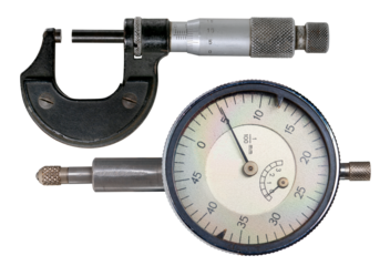 A micrometer for making precision measurements and a dial gauge for shaft runout measurements on an isolated background.